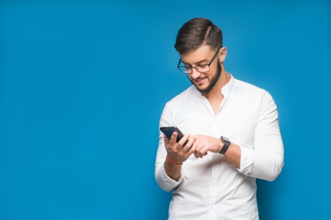 businessman-using-mobile-phone-app-texting-blue