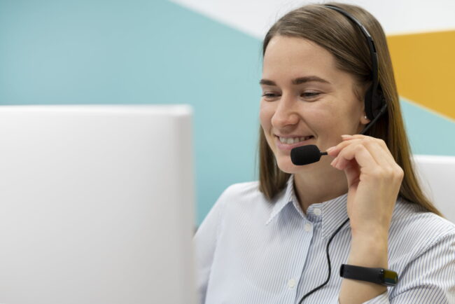 woman-working-call-center-office-with-headphones-computer